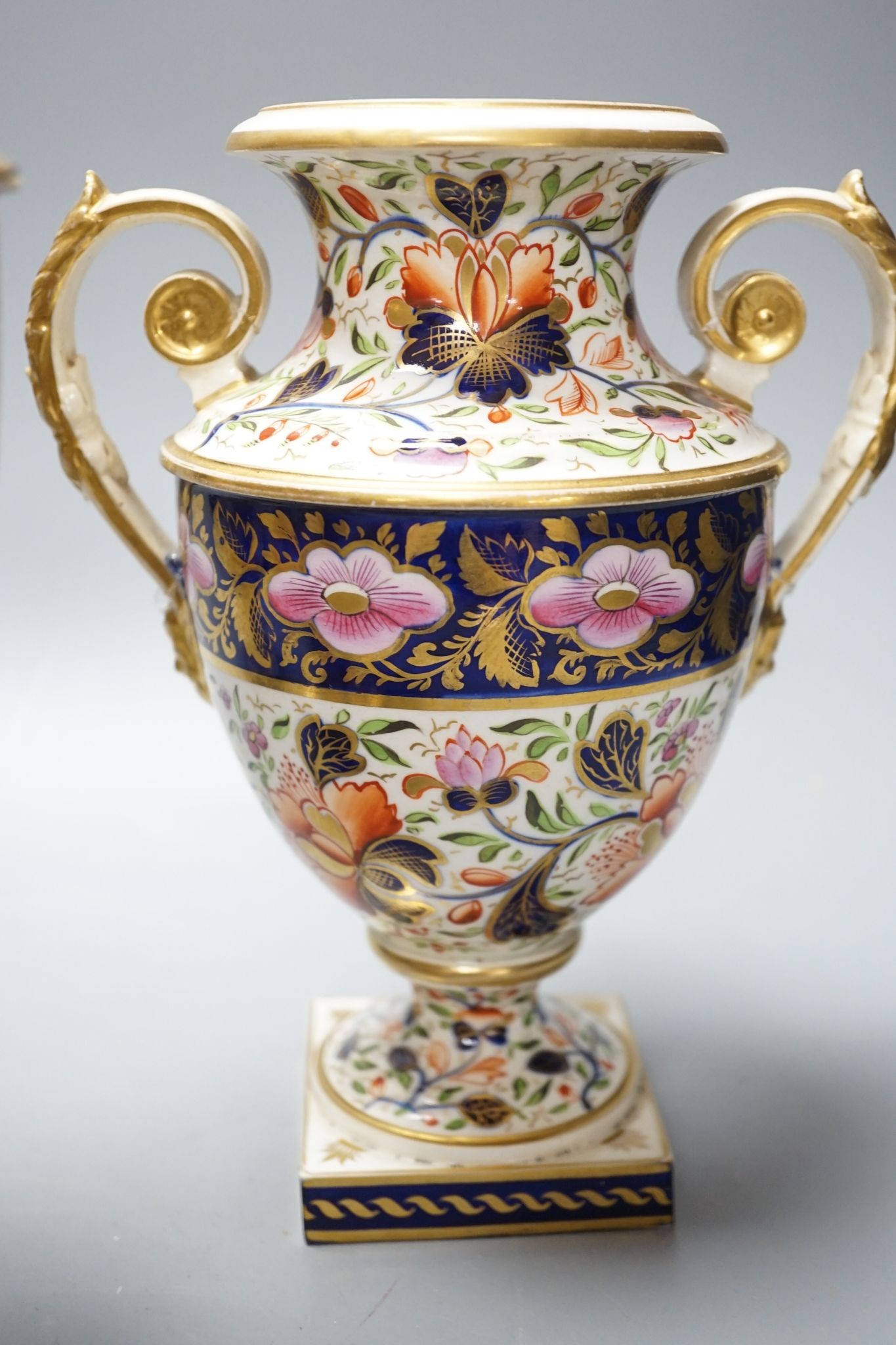 An early 19th century Derby garniture of Imari style vases 29cm